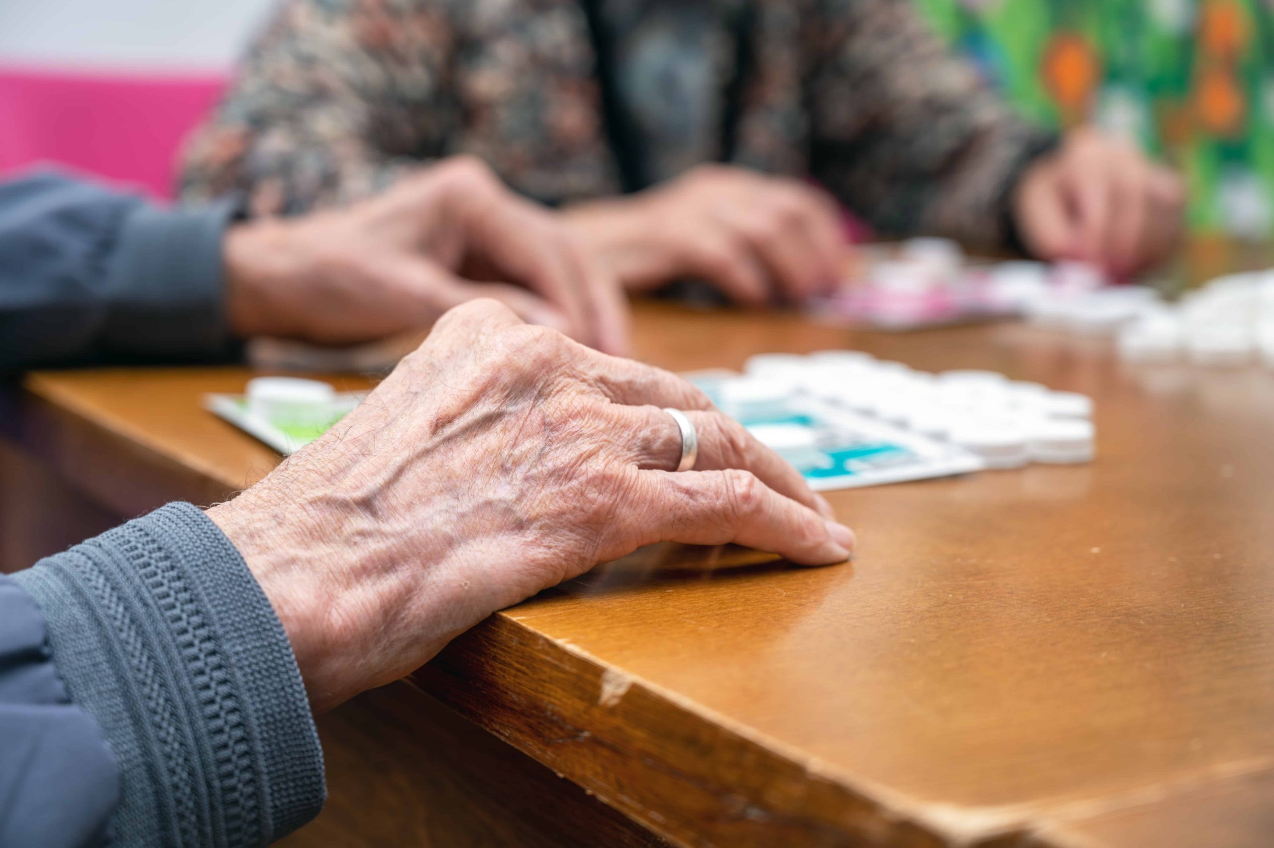 Image of a senior citizen playing bingo.