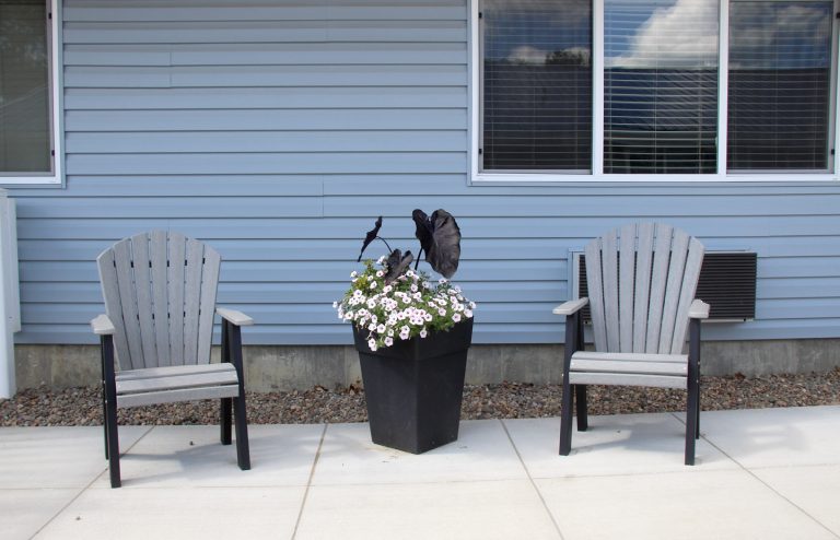 Image of two chairs on the patio.